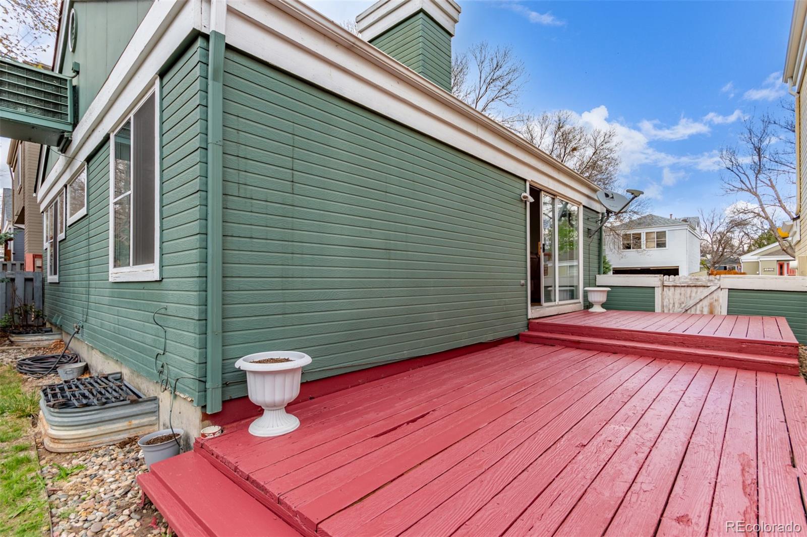 2675 South Deframe Circle Lakewood, CO 80228 - Photo 25 of 28 a view of a patio with wooden floor