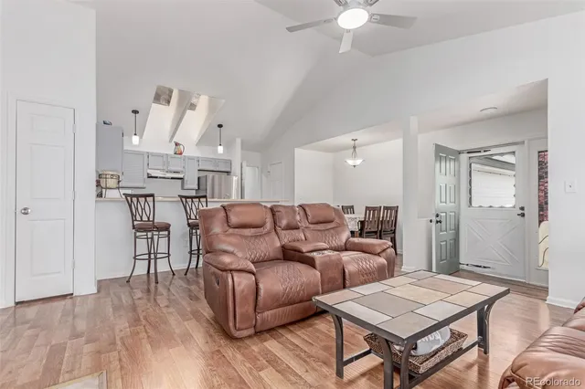 a living room with furniture and a table