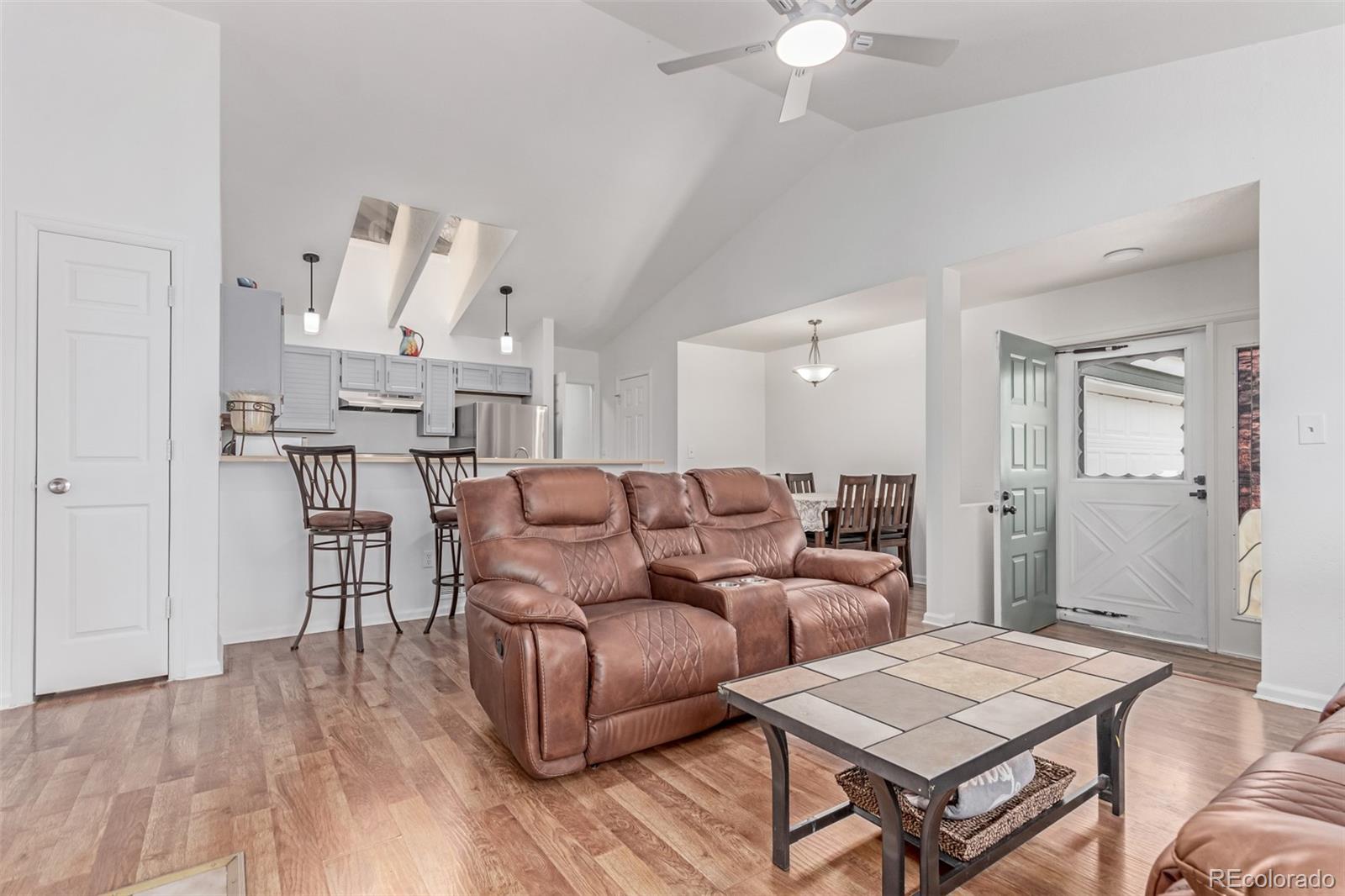 2675 South Deframe Circle Lakewood, CO 80228 - Photo 6 of 28 a living room with furniture and a table