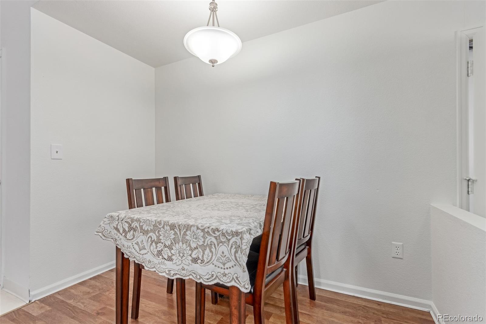 2675 South Deframe Circle Lakewood, CO 80228 - Photo 7 of 28 a view of a dining room with furniture