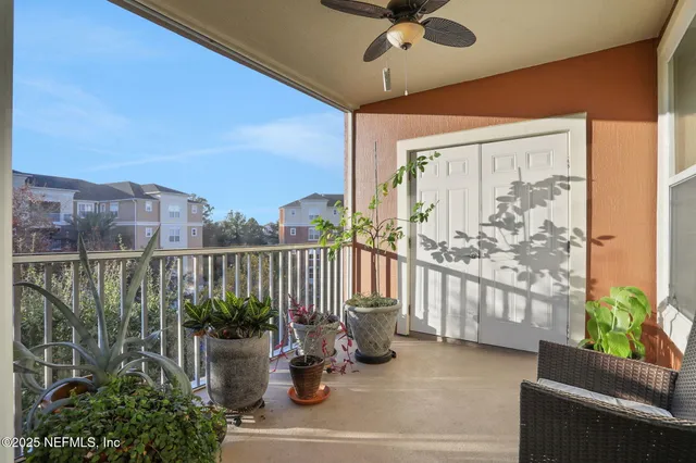 a view of a balcony with chairs
