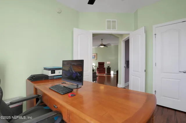 a workspace with furniture and wooden floor