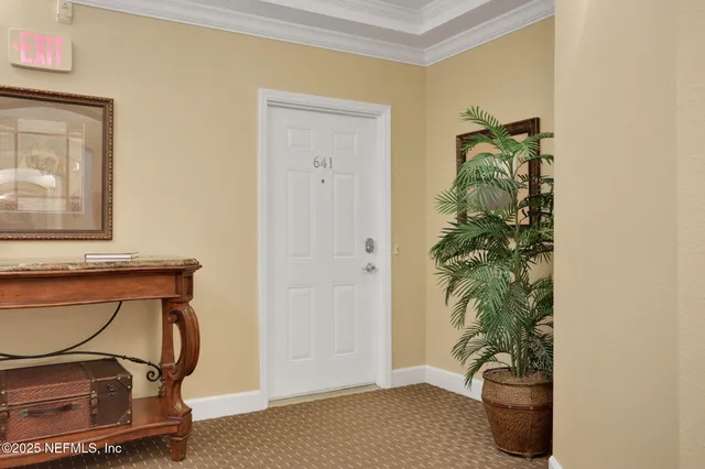 a room with a potted plant and a potted plant