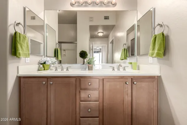 a bathroom with a glass shower door