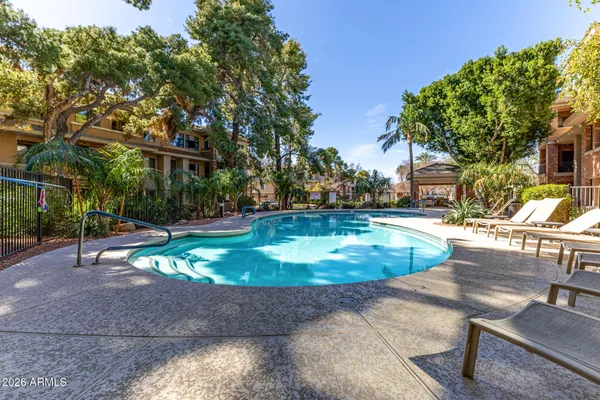 a view of a swimming pool with a patio