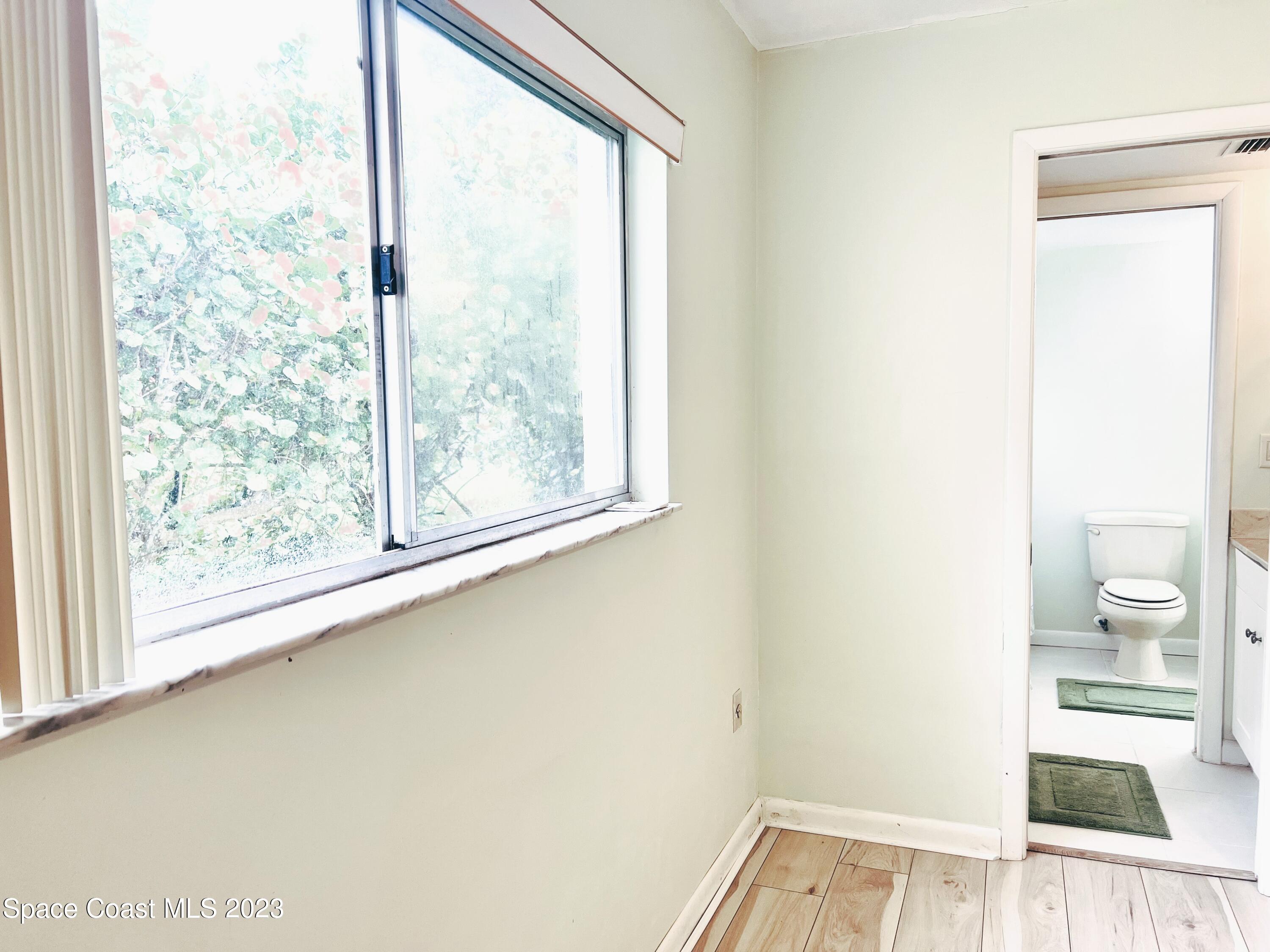 756 Ridge Club Drive, Unit 61 Melbourne, FL 32934 - Photo 17 of 29 a view of a window in an empty room