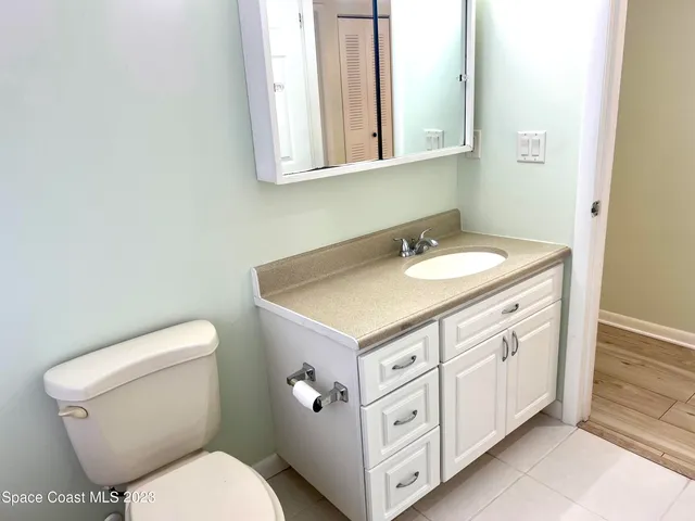 a view of outdoor space with wooden floor and city view