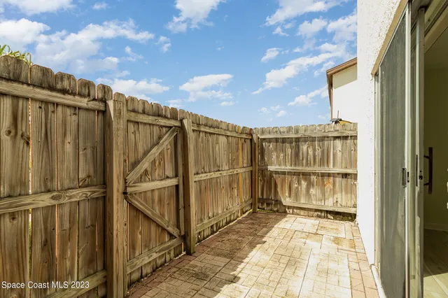 a swimming pool with outdoor seating and yard