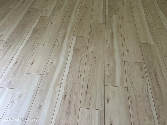a view of a chairs and table in the balcony