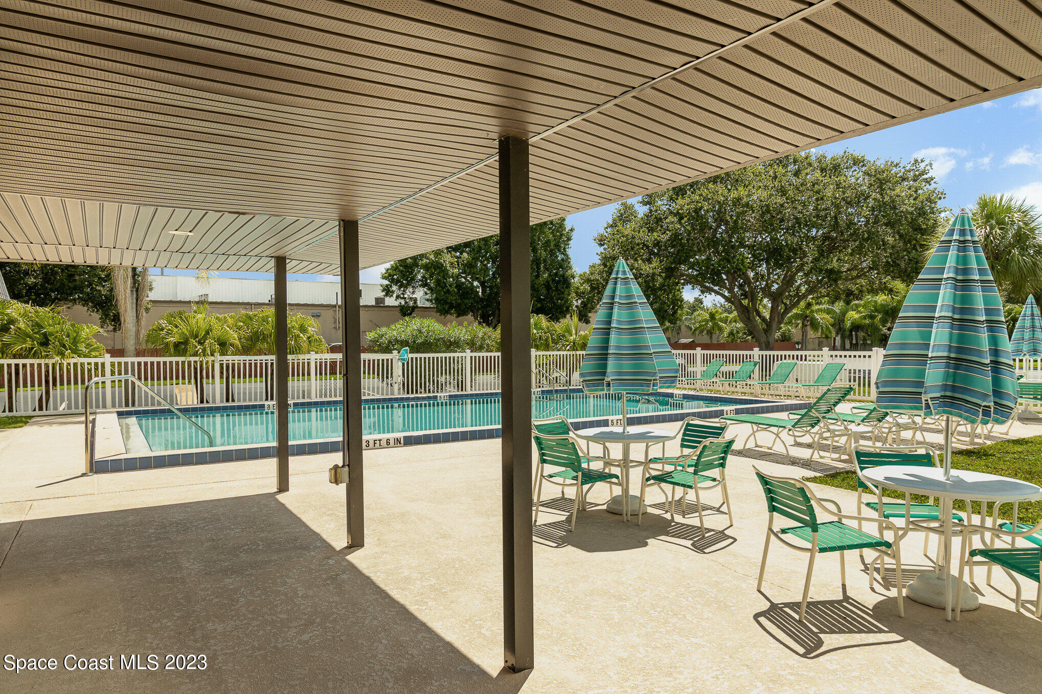 756 Ridge Club Drive, Unit 61 Melbourne, FL 32934 - Photo 28 of 29 a view of a chairs and table in the balcony