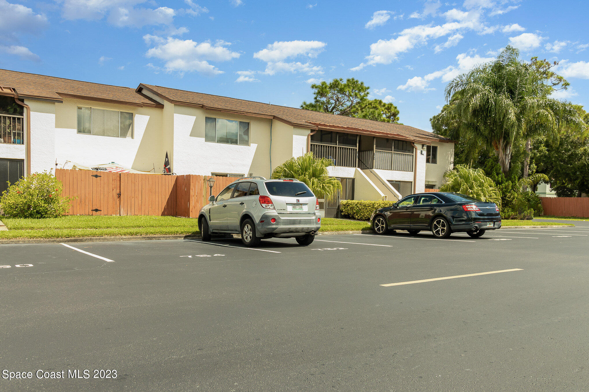 756 Ridge Club Drive, Unit 61 Melbourne, FL 32934 - Photo 29 of 29 a car parked in front of a house