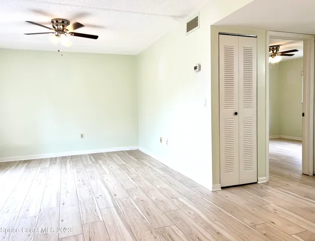 a view of a kitchen with microwave and cabinets