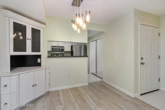 a kitchen with stainless steel appliances granite countertop a stove a microwave and cabinets