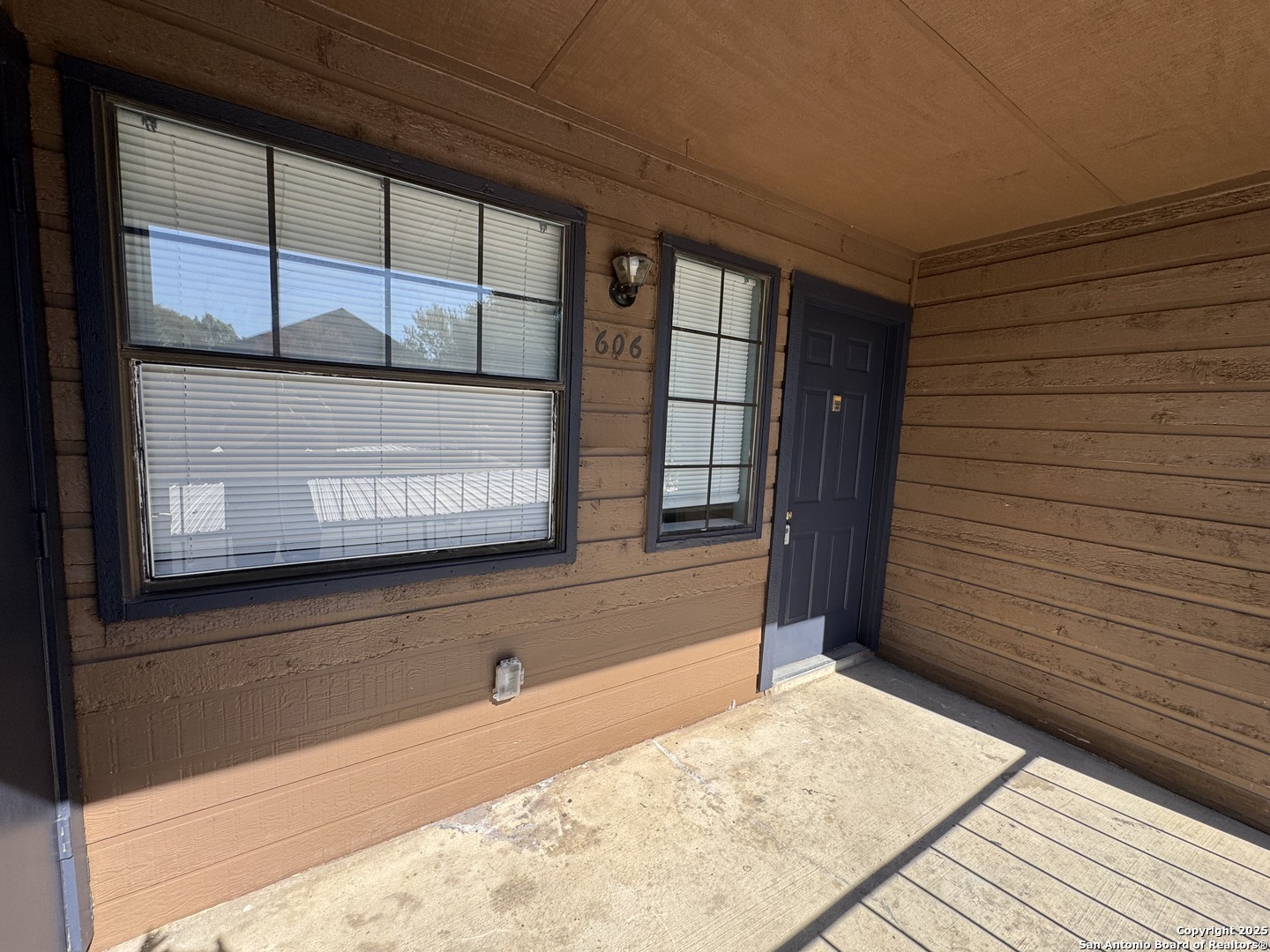 4803 Hamilton Wolfe Road, Unit 606 San Antonio, TX 78229 - Photo 1 of 9 a view of a hallway with wooden floor and windows