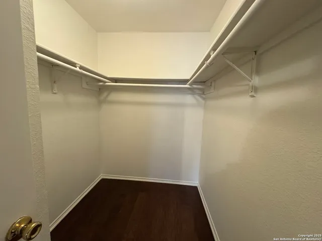 a view of an empty walk in closet