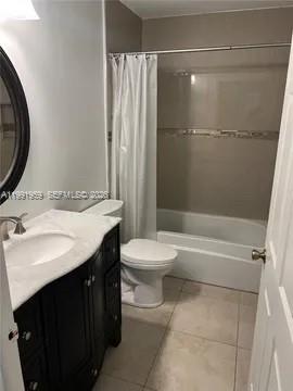 14218 Southwest 176th Terrace Miami, FL 33177 - Photo 12 of 19 a bathroom with a sink a toilet and shower