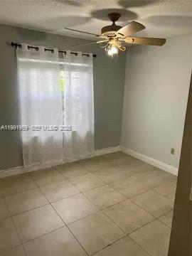 14218 Southwest 176th Terrace Miami, FL 33177 - Photo 3 of 19 a view of a room with a cabinet and a glass door shower