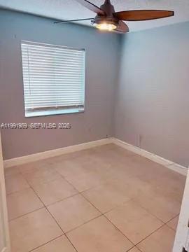 14218 Southwest 176th Terrace Miami, FL 33177 - Photo 4 of 19 a view of a room that has a window in it