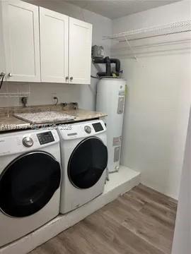 14218 Southwest 176th Terrace Miami, FL 33177 - Photo 7 of 19 a utility room with dryer and washer