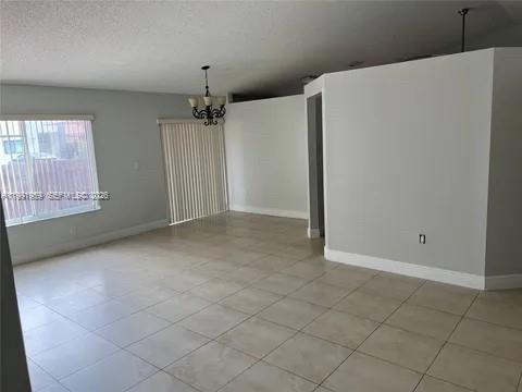 14218 Southwest 176th Terrace Miami, FL 33177 - Photo 8 of 19 an empty room with windows