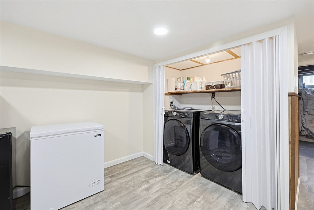 345 Sherman Street Canton, MA 02021 - Photo 33 of 42 a view of a storage and utility room with washer and dryer