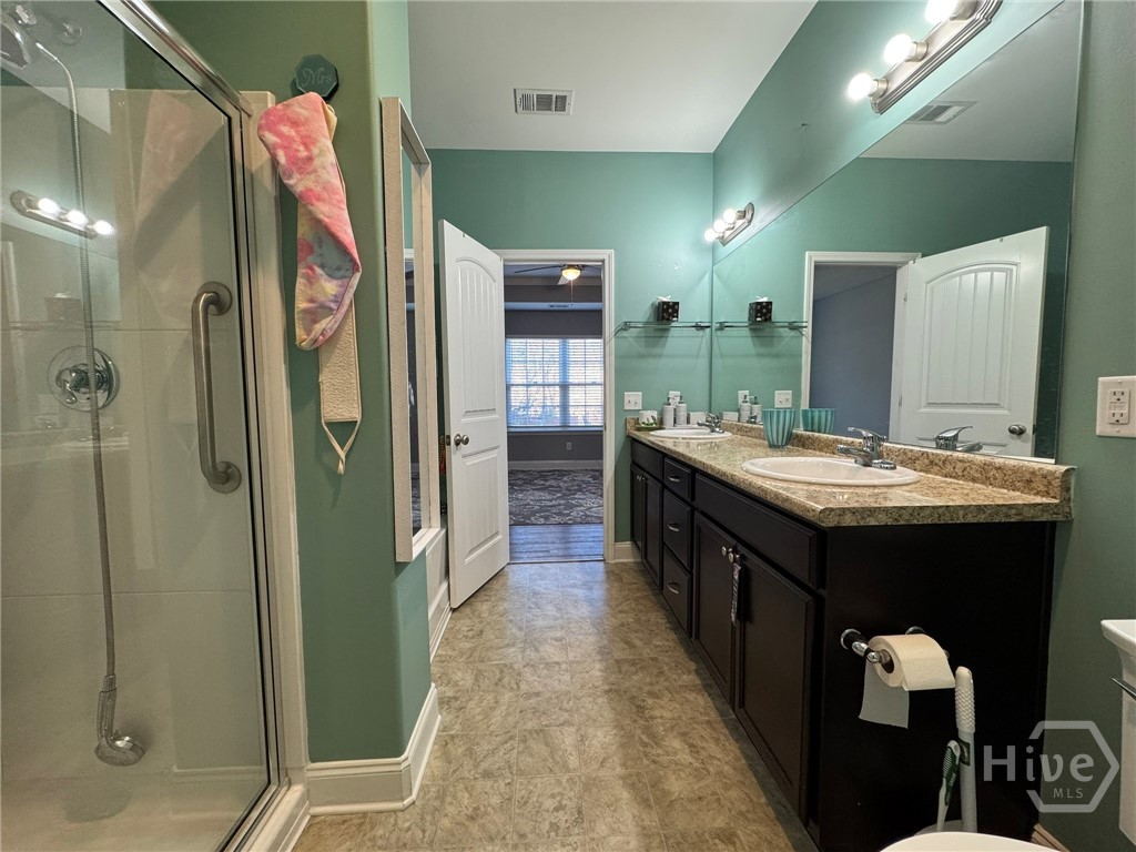 576 Gov Treutlen Circle Pooler, GA 31322 - Photo 11 of 22 Primary Bathroom