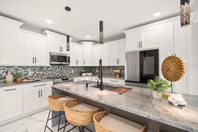 $990,000 | 211 Dolphin Point, Unit 202, Clearwater Beach, FL 33767