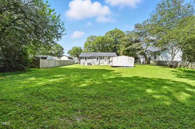 a view of a house with a yard porch and sitting area