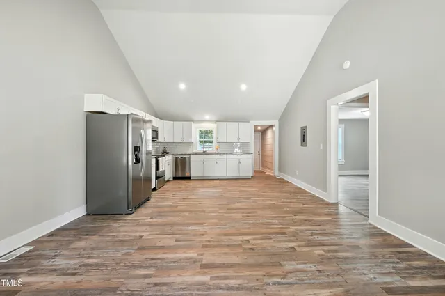 a view of kitchen and refrigerator cabinets