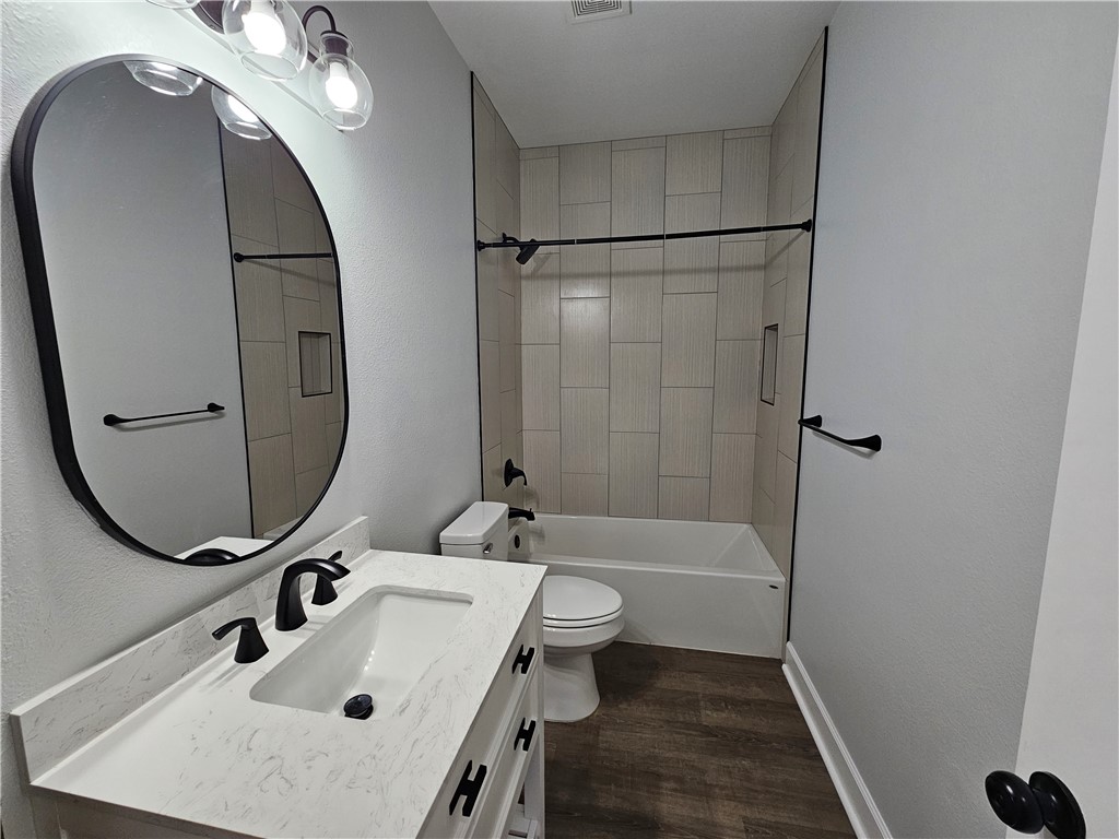 2366 Scott Circle Ingleside, TX 78362 - Photo 16 of 26 a bathroom with a sink a toilet and a mirror