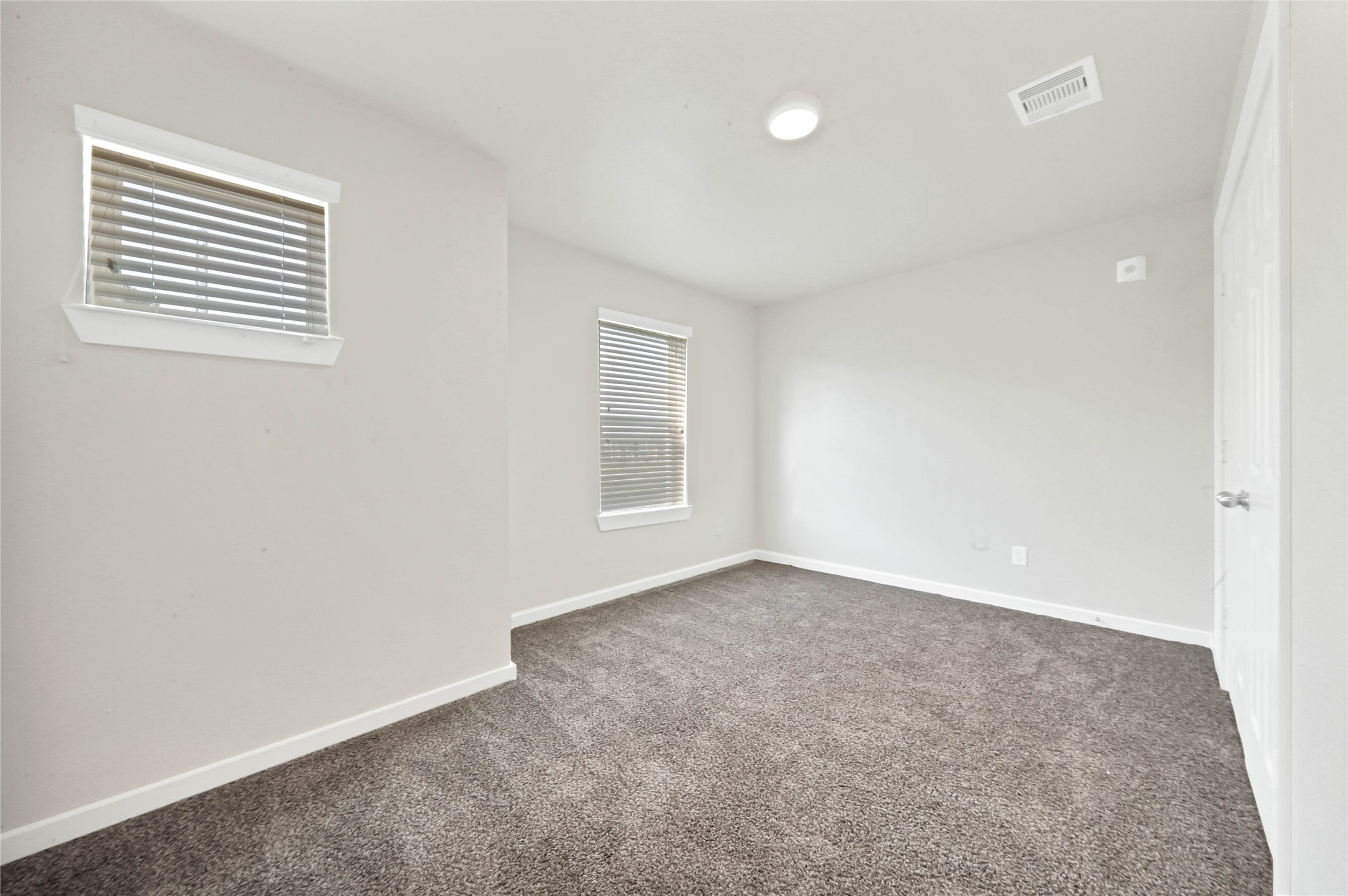 12603 Telge Road, Unit 22EF Cypress, TX 77429 - Photo 13 of 20 an empty room with windows