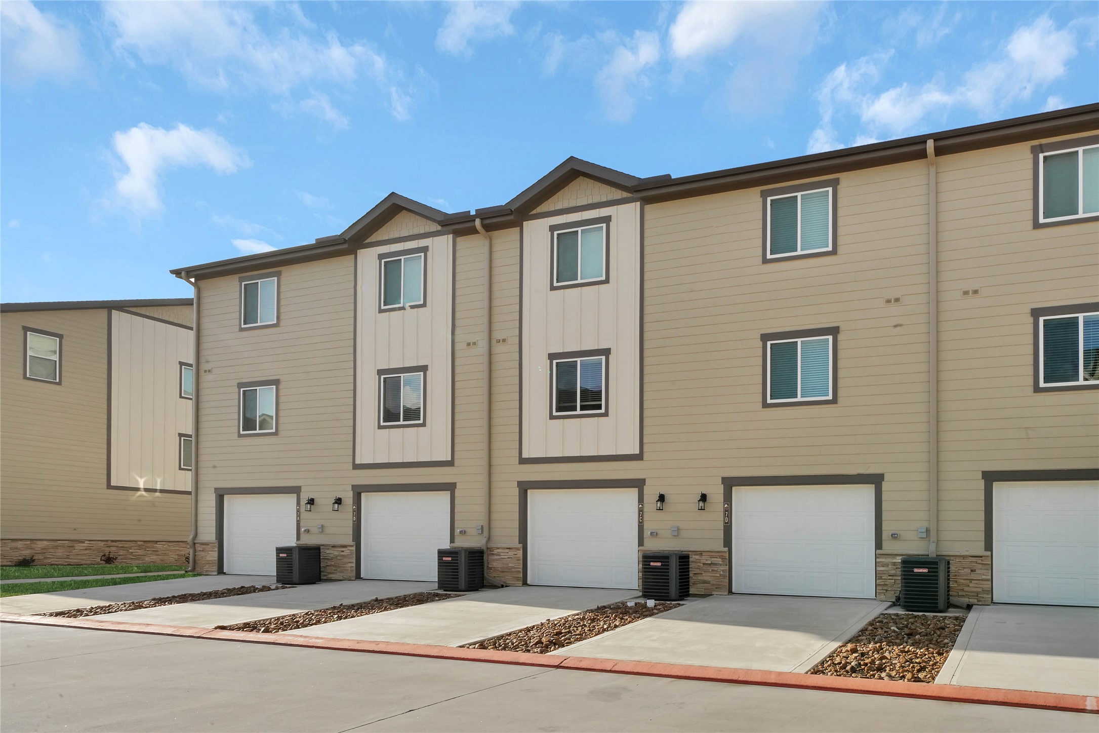 12603 Telge Road, Unit 22EF Cypress, TX 77429 - Photo 19 of 20 a front view of a house with a garden