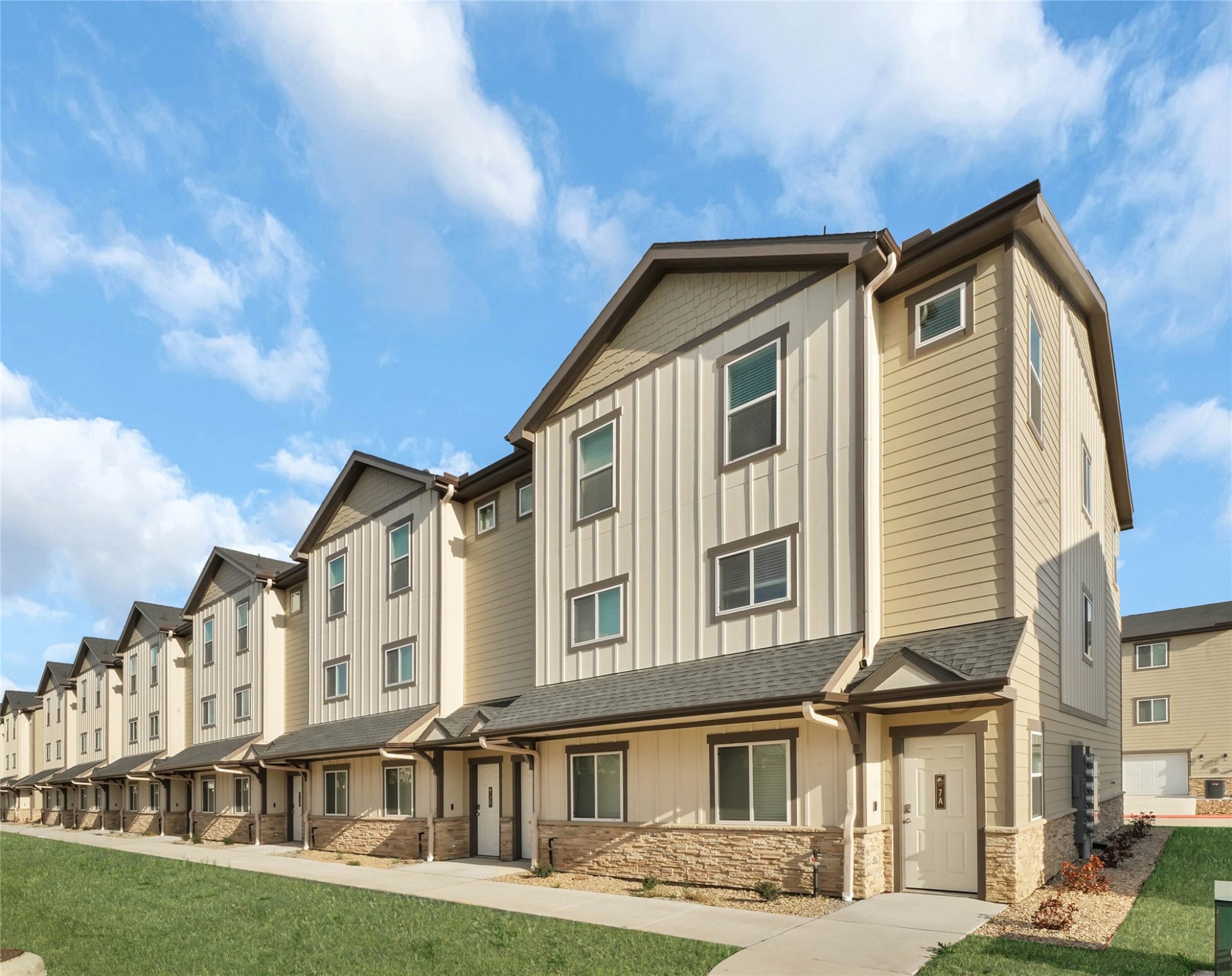 12603 Telge Road, Unit 22EF Cypress, TX 77429 - Photo 2 of 20 a front view of a residential apartment building with a yard