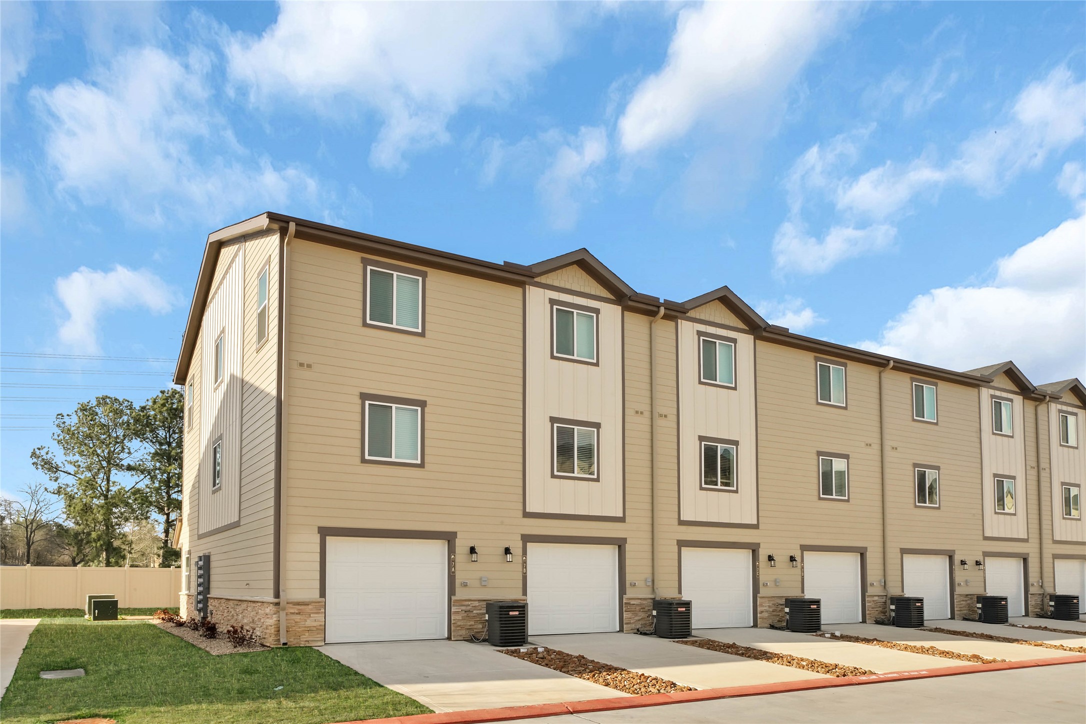 12603 Telge Road, Unit 22EF Cypress, TX 77429 - Photo 3 of 20 a front view of a building with a garden