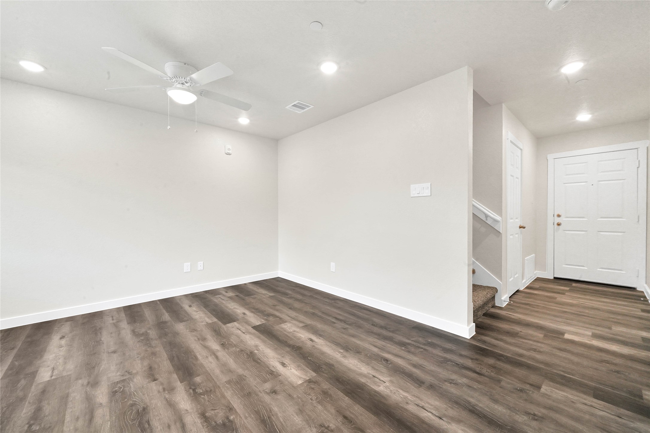 12603 Telge Road, Unit 22EF Cypress, TX 77429 - Photo 6 of 20 an empty room with wooden floor and entrance