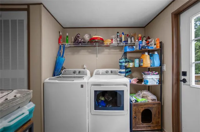 a utility room with dryer and washer