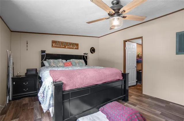 a bathroom with a granite countertop sink a toilet and a shower