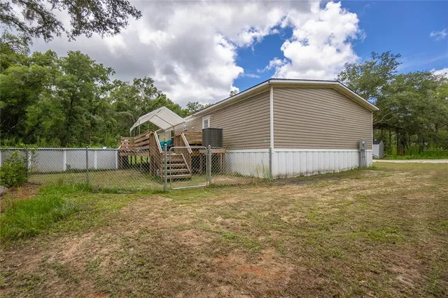 a view of backyard with green space