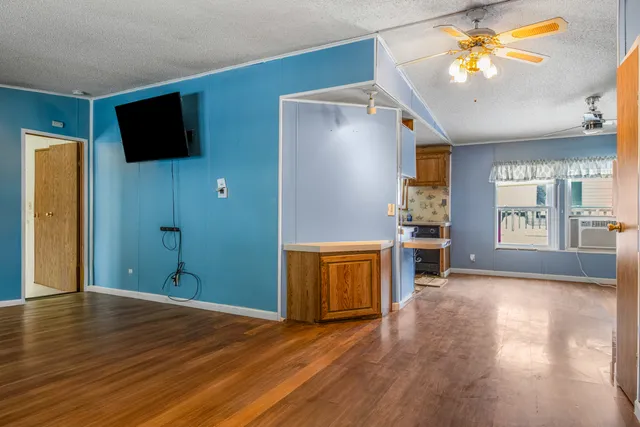 a view of a livingroom with a flat screen tv