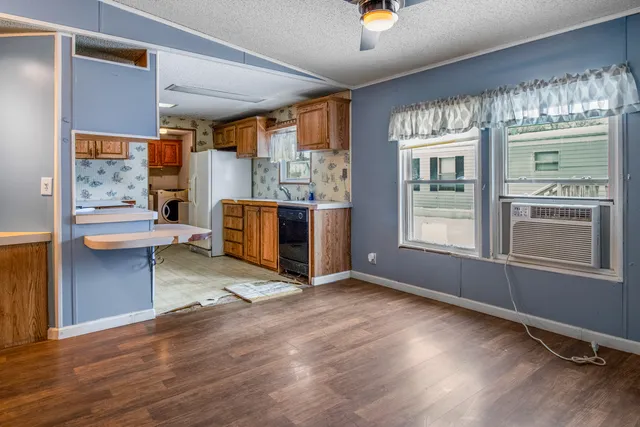 a view of a kitchen with furniture and a fireplace