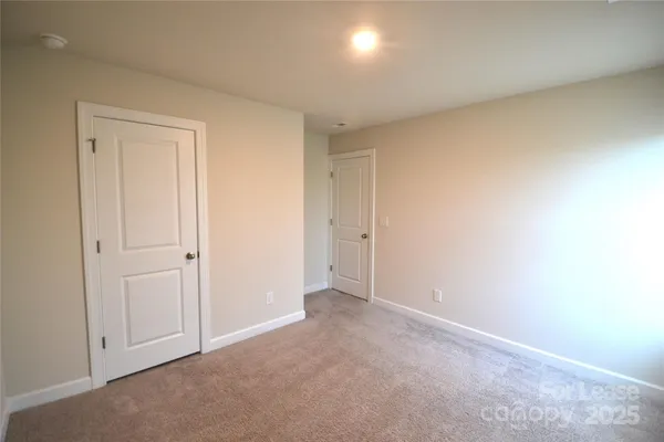 an empty room with closet area