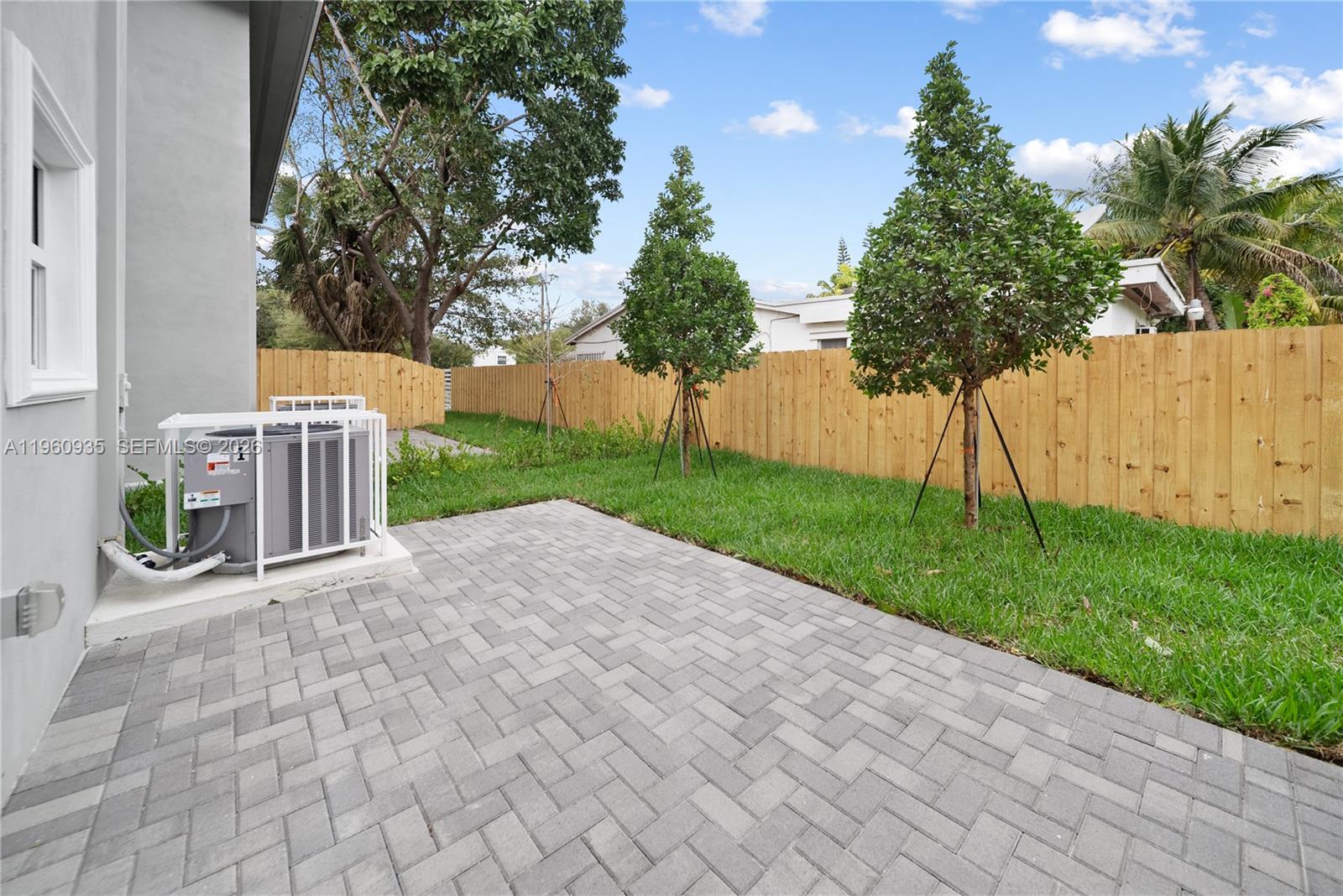 529 Northwest 56th Street Miami, FL 33127 - Photo 12 of 66 a view of a backyard with tree