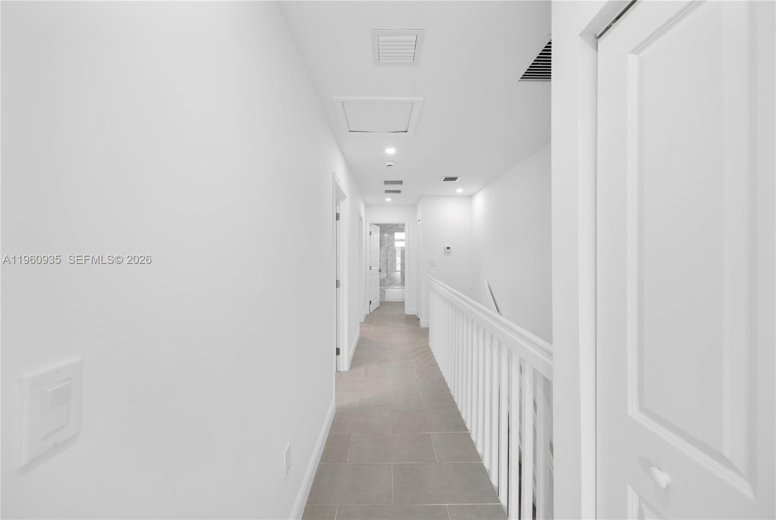 529 Northwest 56th Street Miami, FL 33127 - Photo 27 of 66 a view of a hallway with wooden floor