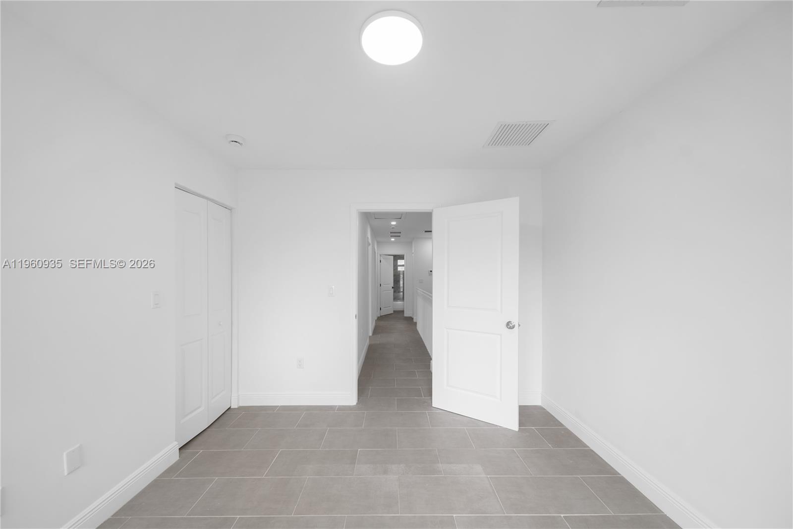 529 Northwest 56th Street Miami, FL 33127 - Photo 45 of 66 a view of an empty room with closet and a window