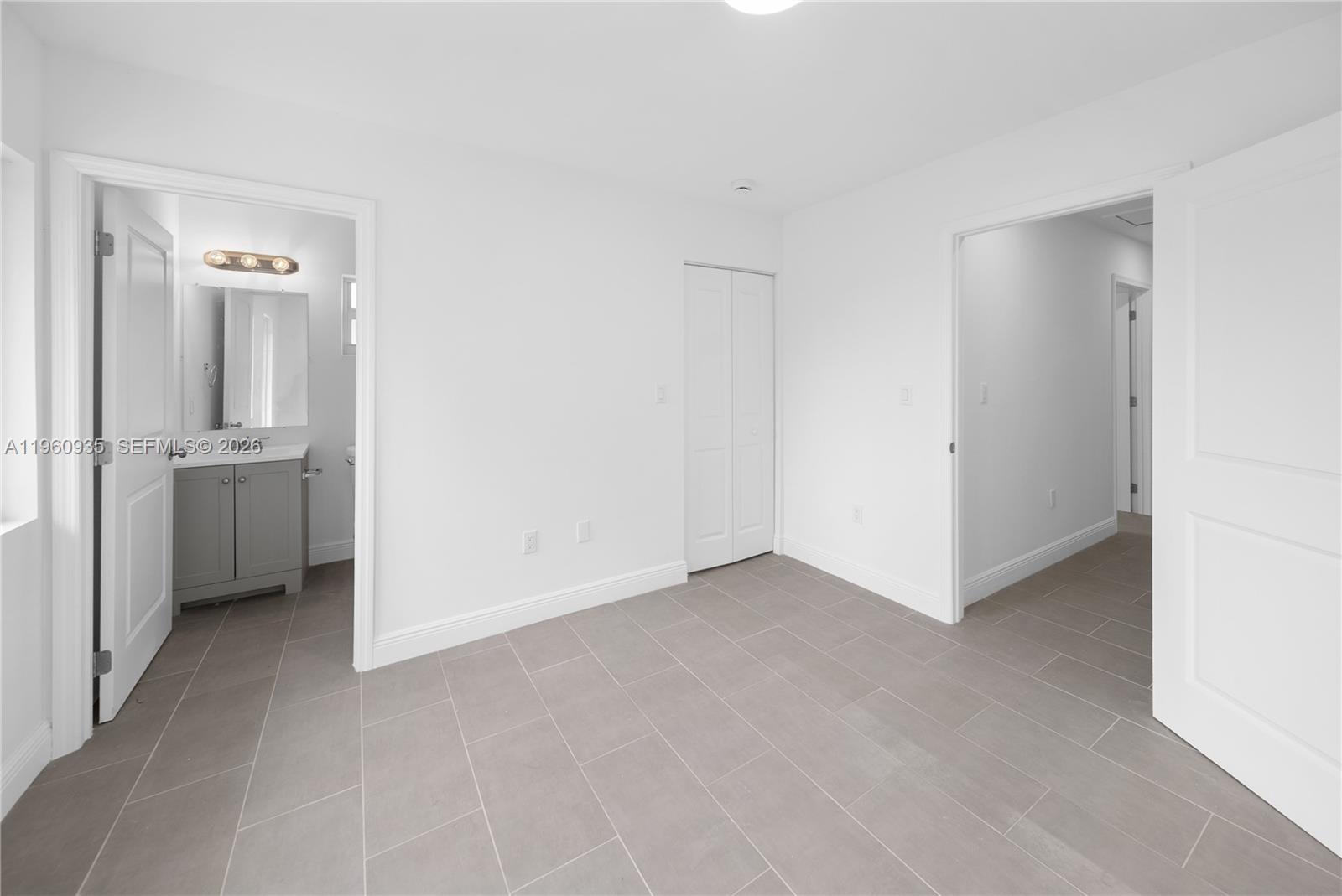 529 Northwest 56th Street Miami, FL 33127 - Photo 46 of 66 a view of an empty room with closet and a window