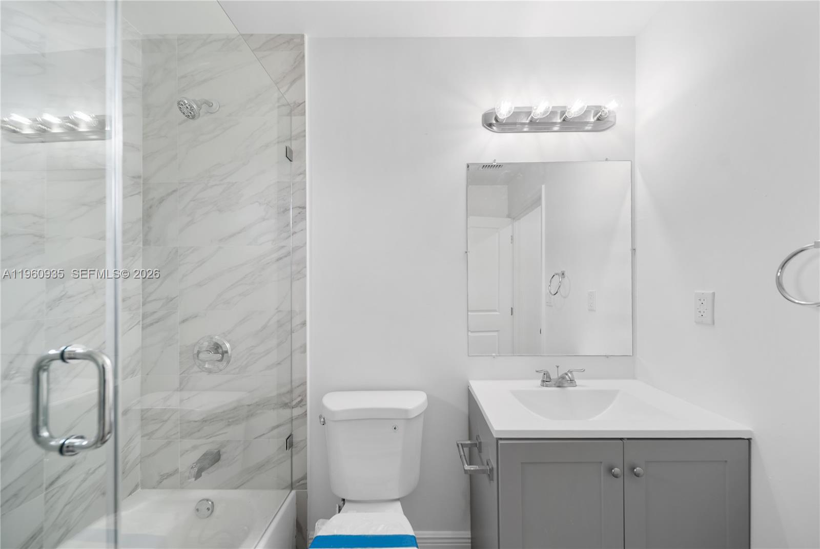 529 Northwest 56th Street Miami, FL 33127 - Photo 49 of 66 a bathroom with a sink a toilet and shower