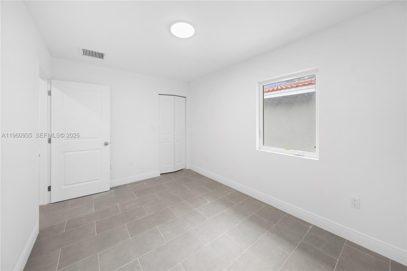 529 Northwest 56th Street Miami, FL 33127 - Photo 51 of 66 a view of an empty room