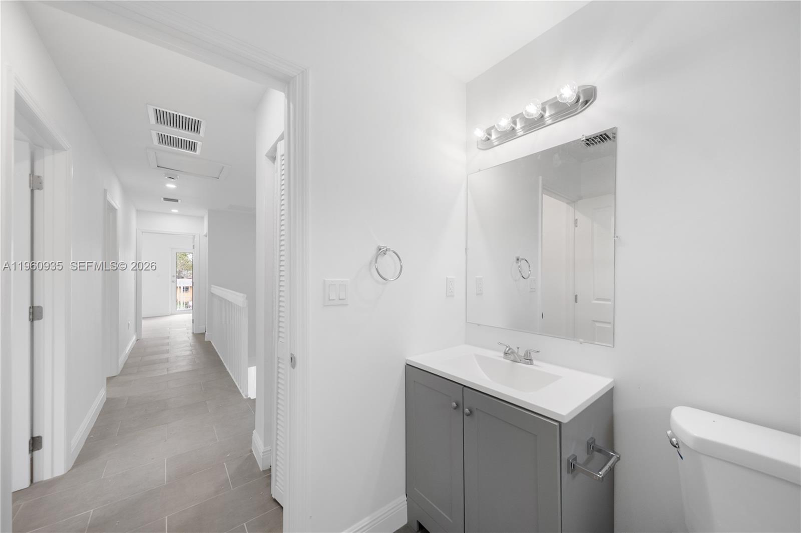 529 Northwest 56th Street Miami, FL 33127 - Photo 59 of 66 a bathroom with a sink a toilet and shower