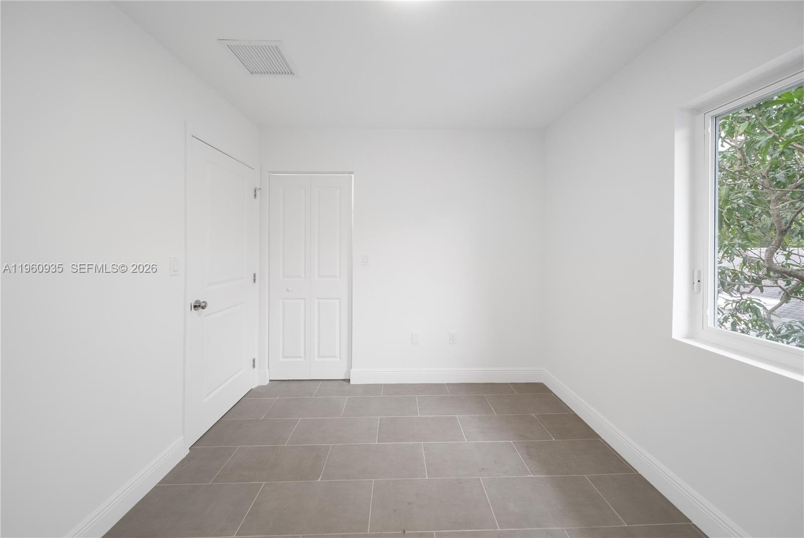 529 Northwest 56th Street Miami, FL 33127 - Photo 61 of 66 a view of an empty room and window