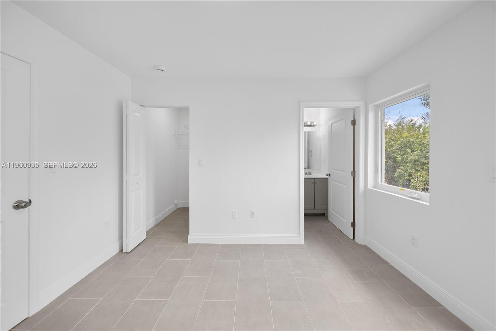 529 Northwest 56th Street Miami, FL 33127 - Photo 64 of 66 a view of an empty room with a window